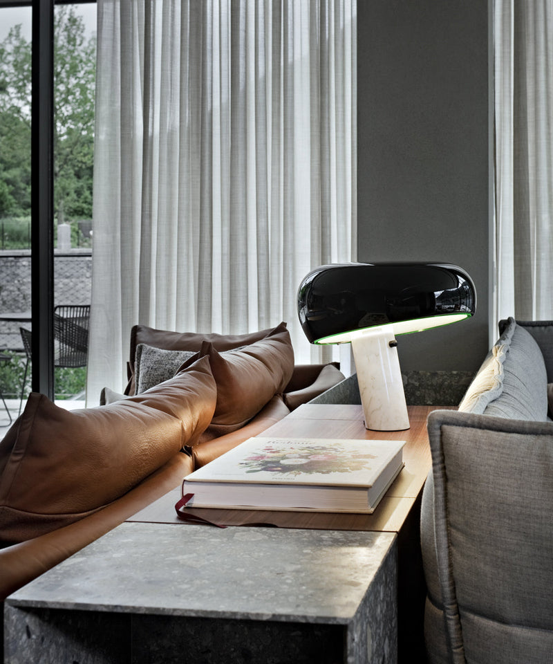 Snoopy table lamp in black on a sideboard in a modern living room