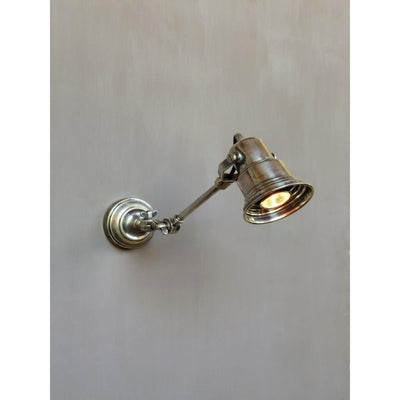 Adjustable pewter wall light